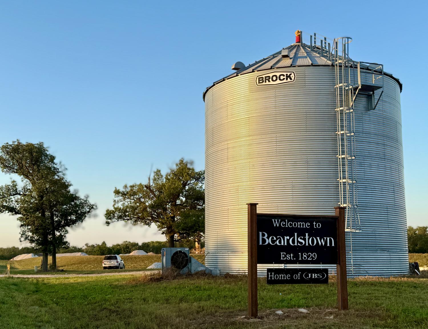 "Welcome to Beardstown, Est. 1829. Home of (JBS)," sign.
