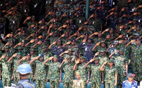 Commanding officers salute during a parade for the Nigeria Army's 150th anniversary celebration in Abuja July 6, 2013.