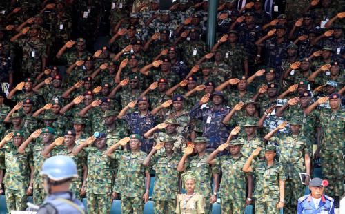 Commanding officers salute during a parade for the Nigeria Army's 150th anniversary celebration in Abuja July 6, 2013.