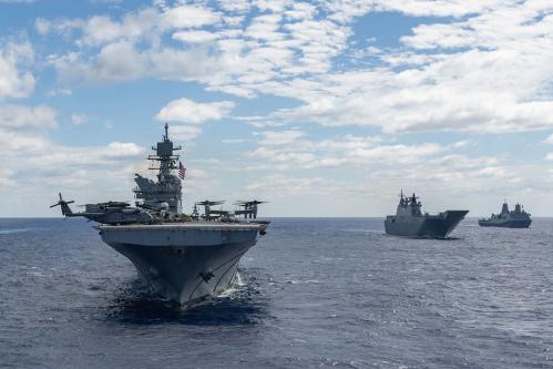 The USS America steams alongside other ships in the Coral Sea during a formation exercise with Australian, South Korean, New Zealand, French and Japanese vessels as part of Talisman Sabre 25, July 20, 2025.