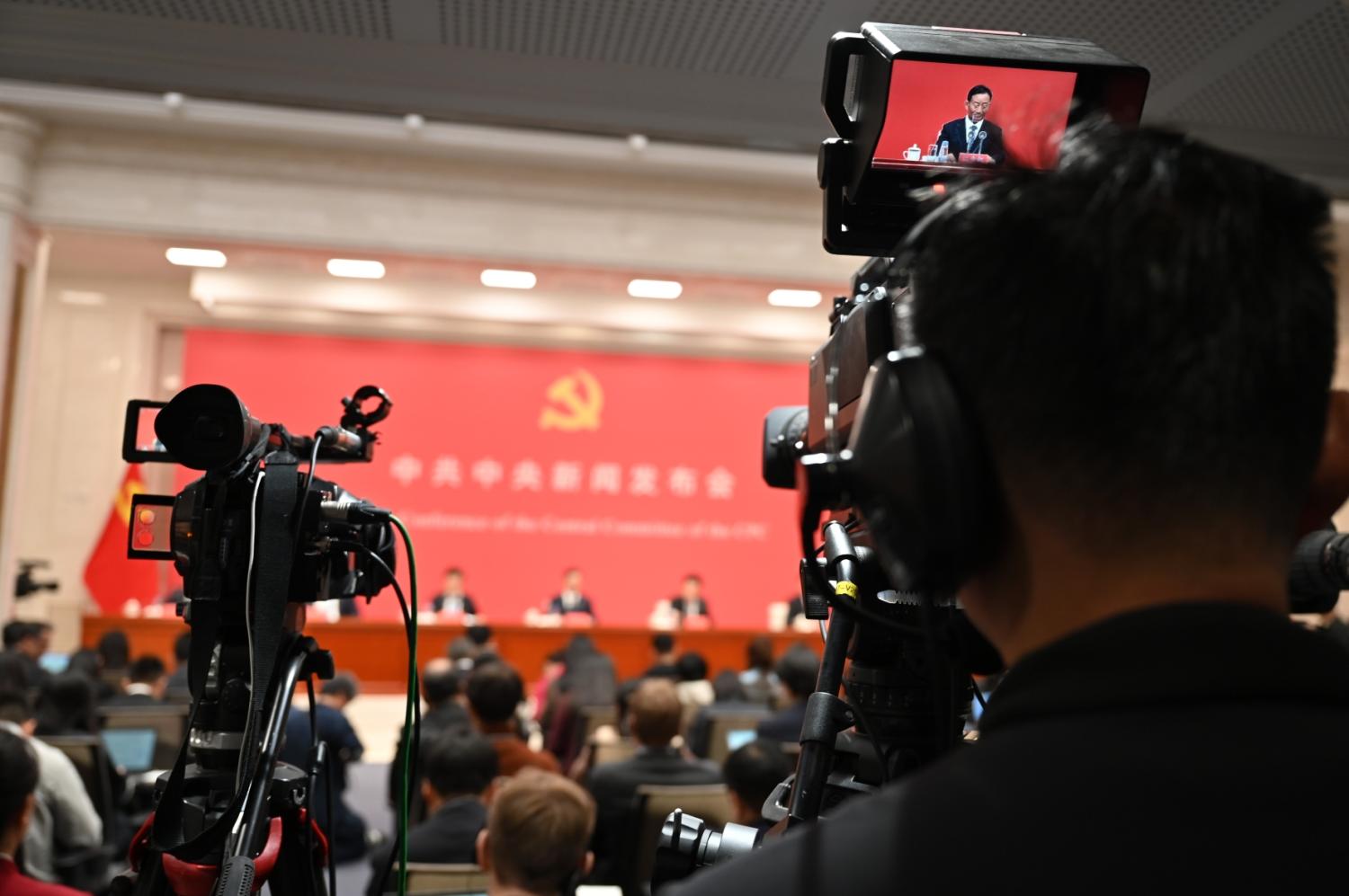 Journalists sit in a press conference of the Central Committee of the Chinese People's Congress. The Chinese Communist Party had previously concluded its Fourth Plenum, a meeting lasting several days at which the upcoming five-year plan was discussed this year.