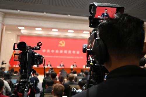 Journalists sit in a press conference of the Central Committee of the Chinese People's Congress. The Chinese Communist Party had previously concluded its Fourth Plenum, a meeting lasting several days at which the upcoming five-year plan was discussed this year.