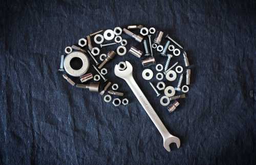 Brain made of nuts, bolts, and a wrench