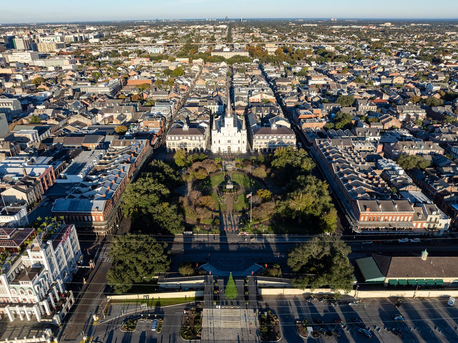 Aerial view of Jackson Square with Saint Louis Cathedral church and surrounding extant historical buildings from French Quarter in morning. The historic district section of the city of New Orleans.