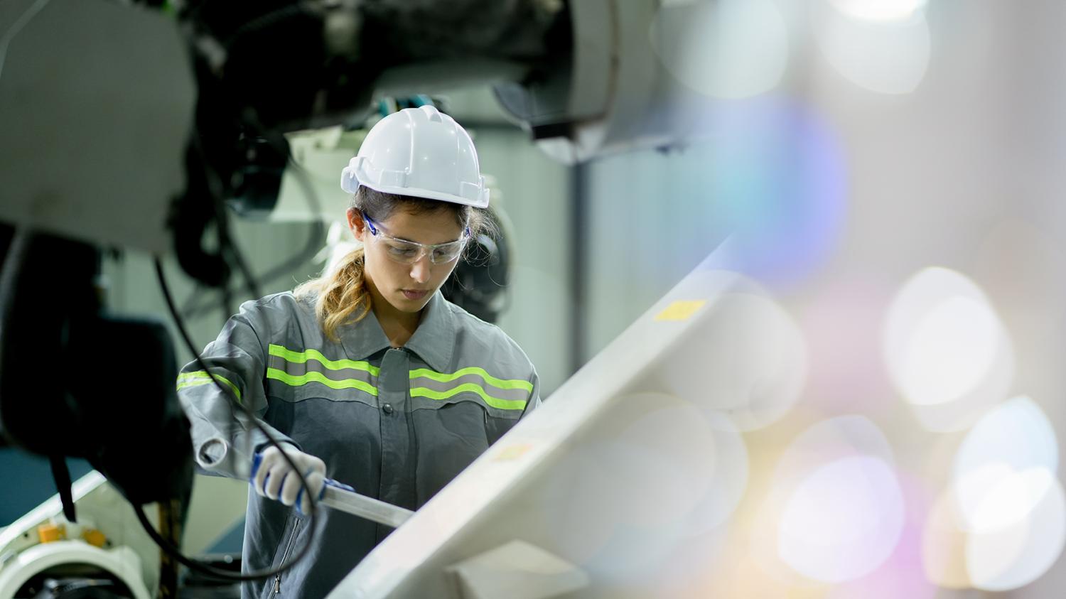 Professional engineering, worker, woman Quality control, maintenance, check in factory, Workshop for factory operators, Robotics engineer Female worker in a modern automotive manufacturing plant.