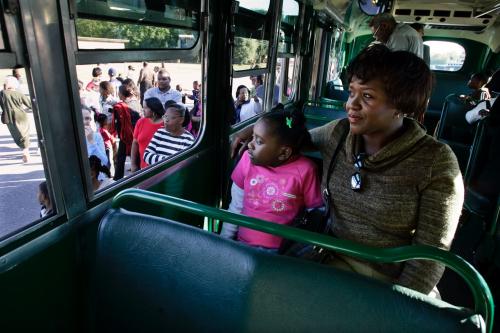 Sheila Watkins (right) and her daughter ride a restored Montgomery bus from the Rosa Parks Museum—the same model Parks rode—after paying their respects at St. Paul African Methodist Episcopal Church in Montgomery, Alabama, on Oct. 29, 2005.