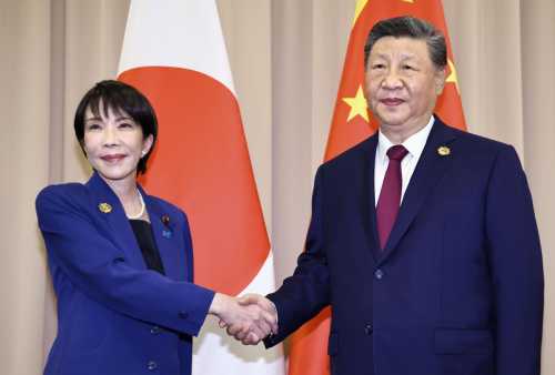 Japanese Prime Minister Sanae Takaichi (L) shakes hands with Chinese President Xi Jinping ahead of their talks in Gyeongju, South Korea, on Oct. 31, 2025.