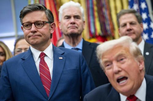 Speaker of the United States House of Representatives Mike Johnson looks on as U.S. President Donald J. Trump speaks before signing the funding package to reopen the federal government in the Oval Office of the White House in Washington, D.C., on Nov. 12, 2025.