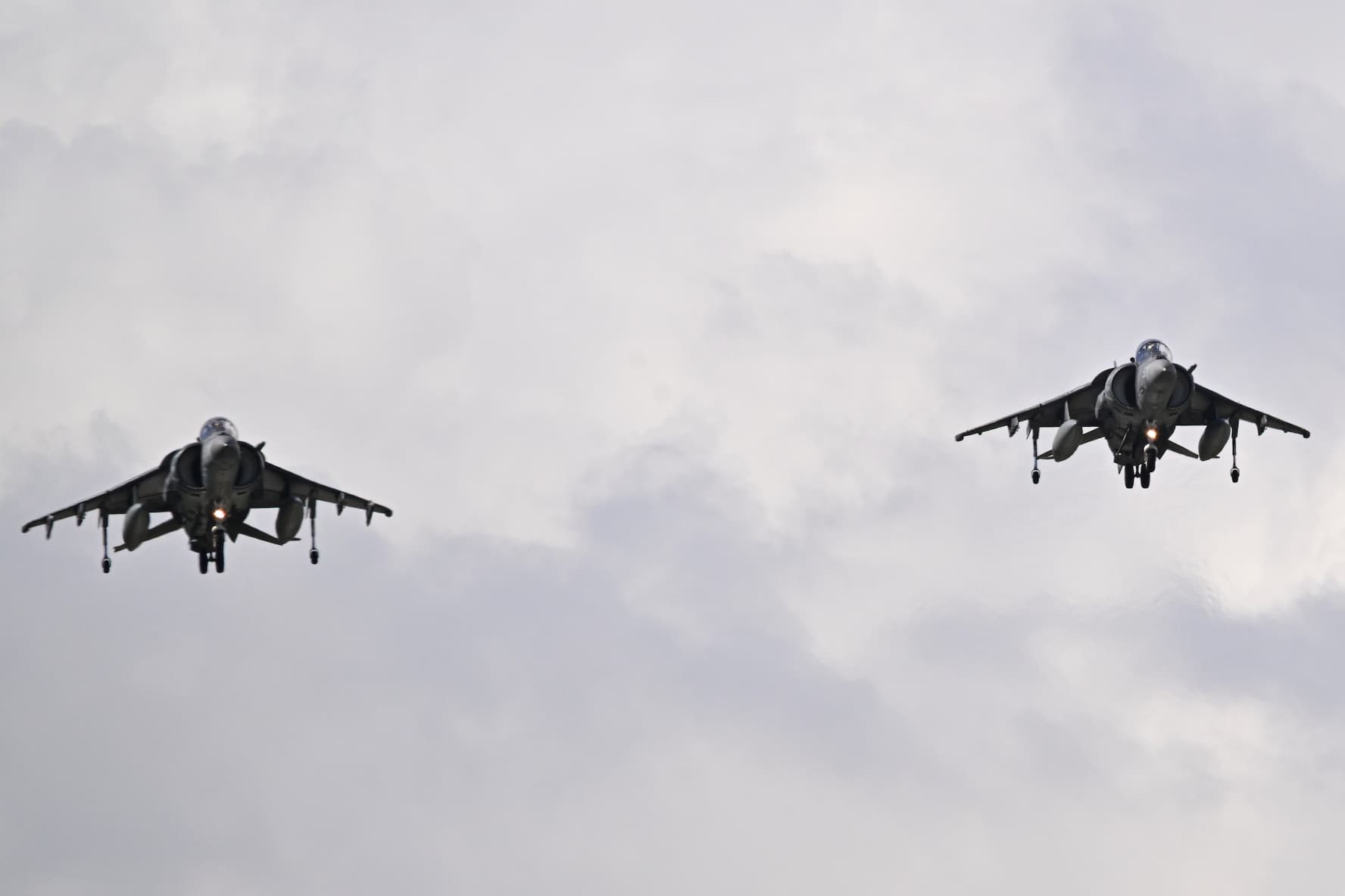 A U.S. Marine Corps AV-8B Harrier II makes a low-altitude pass over Mercedita International Airport on December 2, 2025, in Ponce, Puerto Rico. The Trump administration continues to carry out strikes in the Caribbean Sea against boats suspected of transporting drugs. The president said the vessels are operated by the Tren de Aragua gang, amid rising tensions with Venezuela.