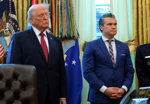 U.S. President Donald Trump stands next to U.S. Secretary of War Pete Hegseth during a ceremony for the presentation of the Mexican Border Defense Medal in the Oval Office of the White House on December 15, 2025 in Washington, DC.