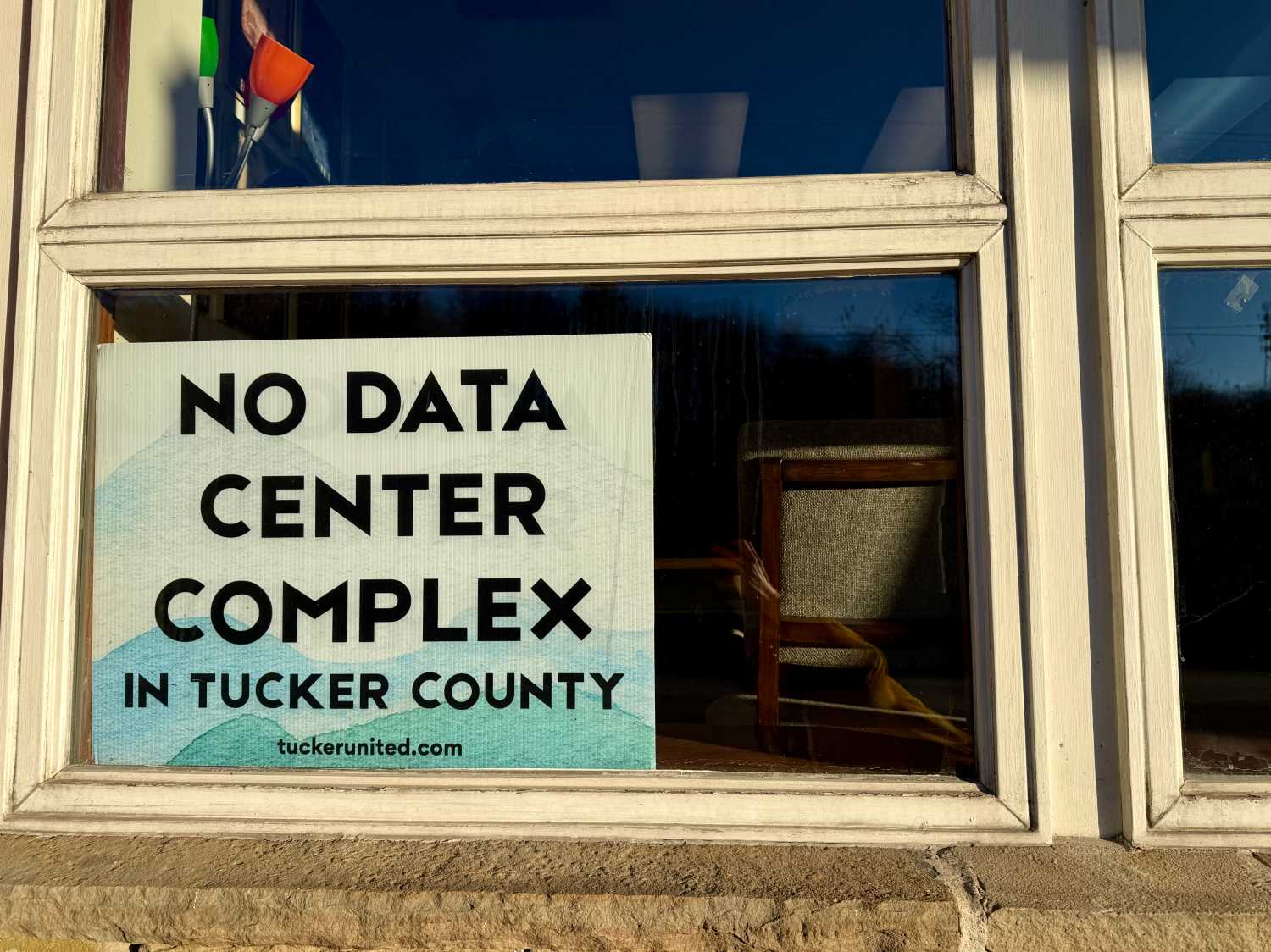 "No Data Center" sign seen in a store in Tucker County.