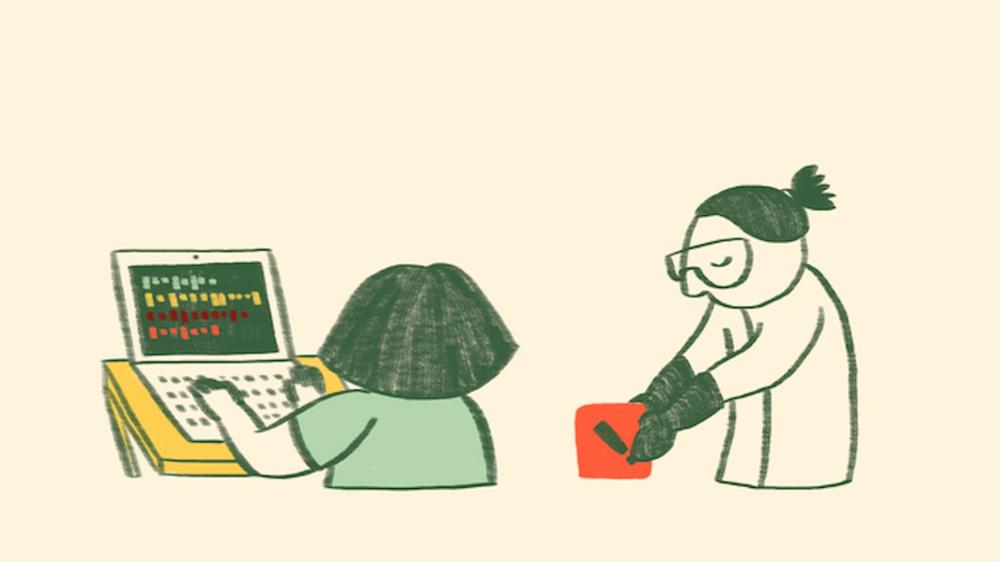 Two people are illustrated in a warm, cartoon style, one on the left and one on the right. The person on the left, who has their back to the viewer, and is typing on a laptop which is sitting on a table. They are white, their hair is shoulder length and dark, and they are wearing a green t-shirt. The computer screen is dark with rows of coloured squares representing programming. The person on the right looks similar but their hair is now tied back in a pony tail, and they are wearing a white lab coat and safety goggles. They are reaching down to lift up an orange hazard label which is about the size of a book. The label is an orange square with a black exclamation mark in the middle. The person looks like they are being careful as they lift it.