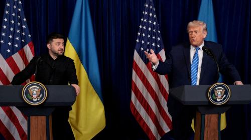 Ukrainian President Volodymyr Zelenskiy listens to U.S. President Donald Trump, after Trump said that Russian President Vladimir Putin expressed willingness to help Ukraine "succeed", during a press conference at Trump's Mar-a-Lago club, in Palm Beach, Florida, U.S., December 28, 2025. REUTERS/Jonathan Ernst/File Photo