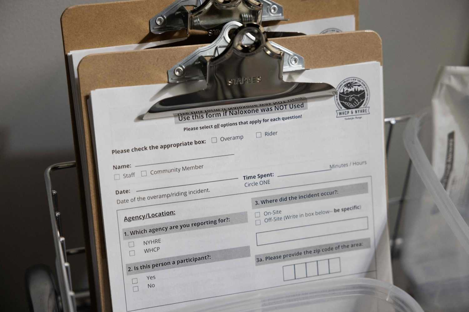 In this November 30, 2021 photo, information forms are shown during the media tour of the supervised drug injection site OnPoint, in New York.