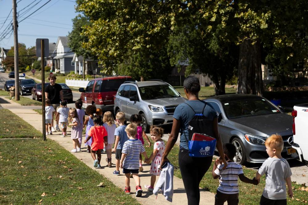 Children attending Sonshine Christian Academy go for a walk in Drexel Hill, Pennsylvania, on September, 11, 2024.
