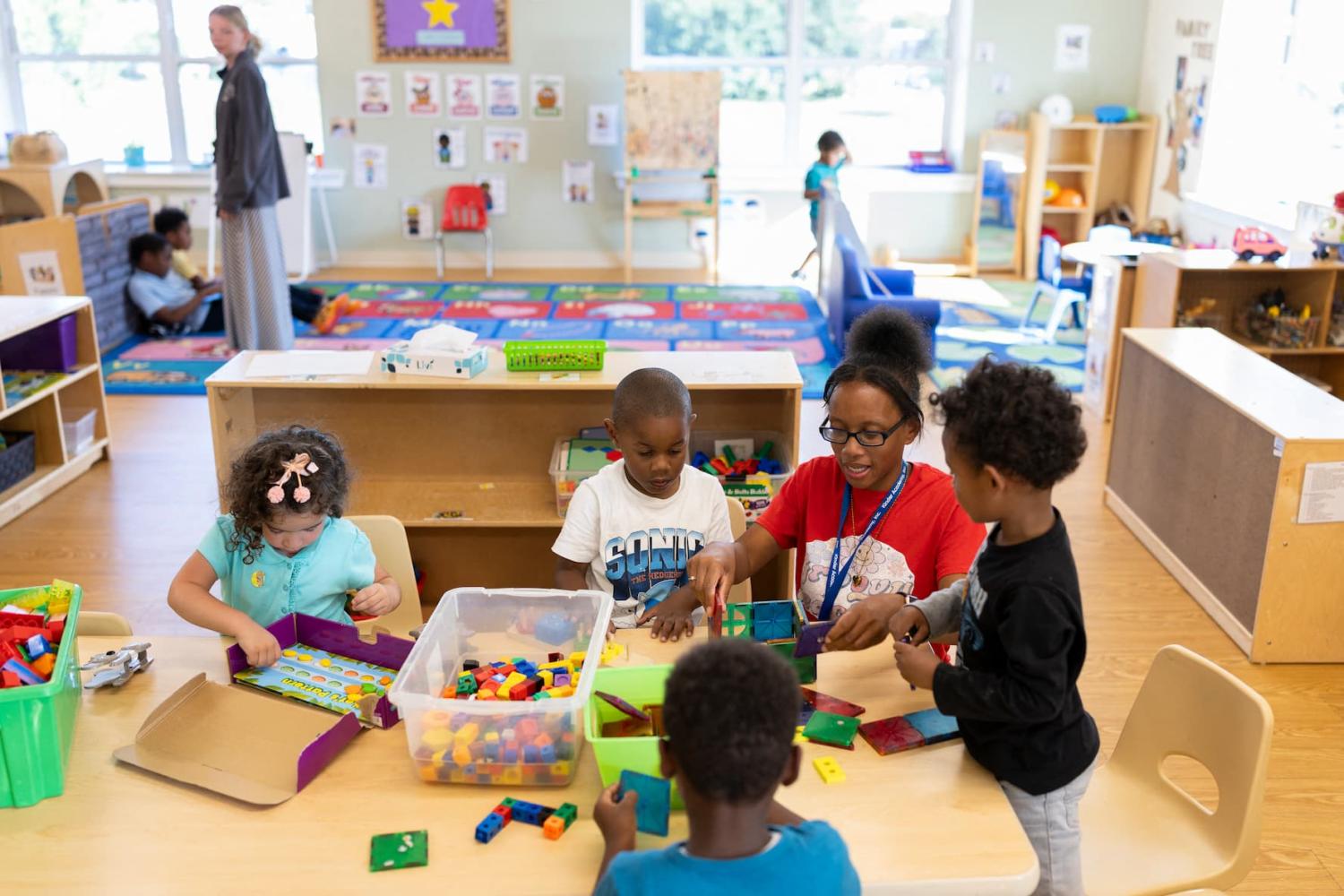 A staff member at Kinder Academy engages with children in Philadelphia, Pennsylvania, on Sept. 11, 2024.