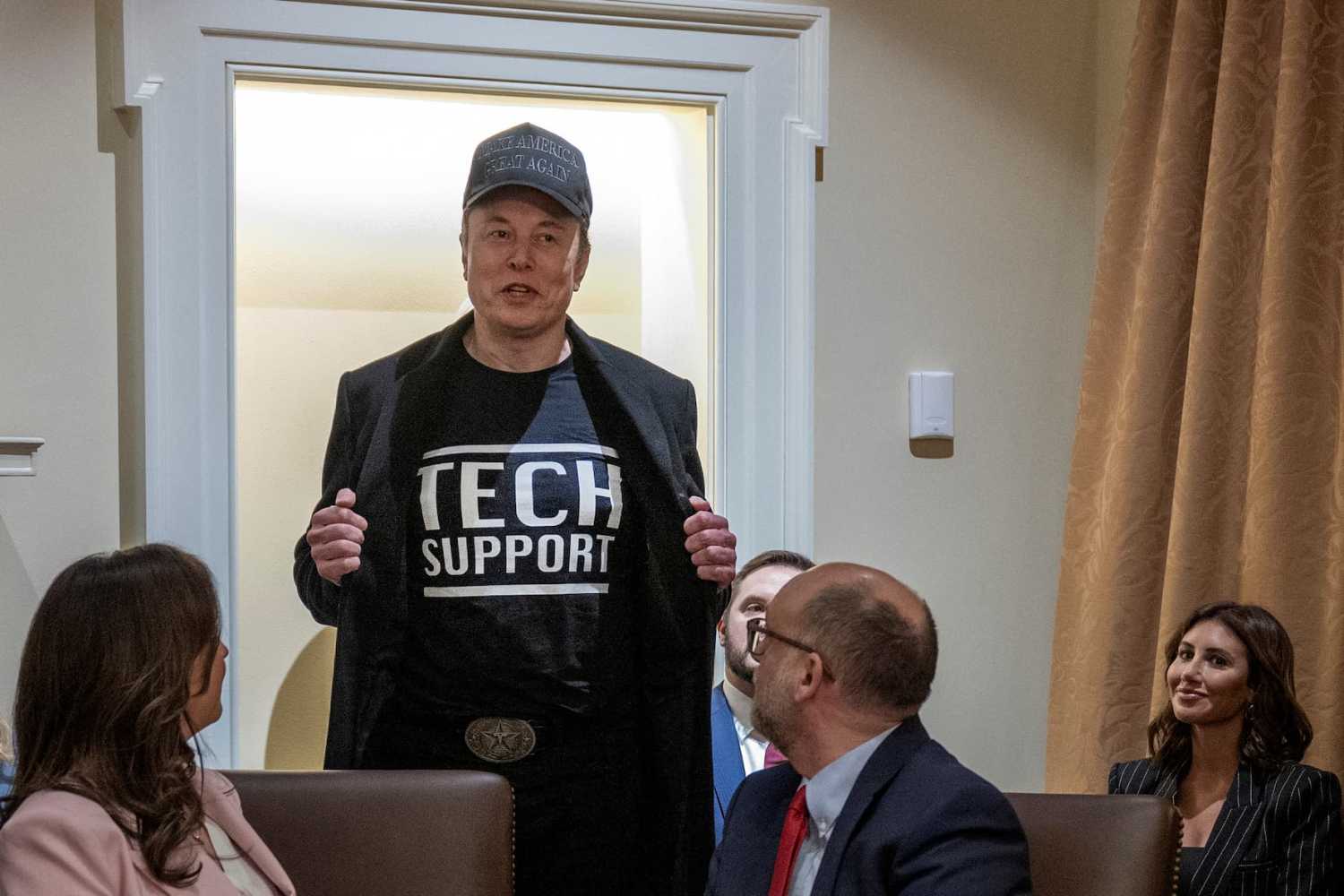 Leader of the Department of Government Efficiency Elon Musk wears a shirt that says "Tech Support" as he speaks during the first cabinet meeting of U.S. President Donald Trump's second term in the Cabinet Room at the White House in Washington, D.C., on Feb. 26, 2025.