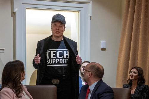 Leader of the Department of Government Efficiency Elon Musk wears a shirt that says "Tech Support" as he speaks during the first cabinet meeting of U.S. President Donald Trump's second term in the Cabinet Room at the White House in Washington, D.C., on Feb. 26, 2025.
