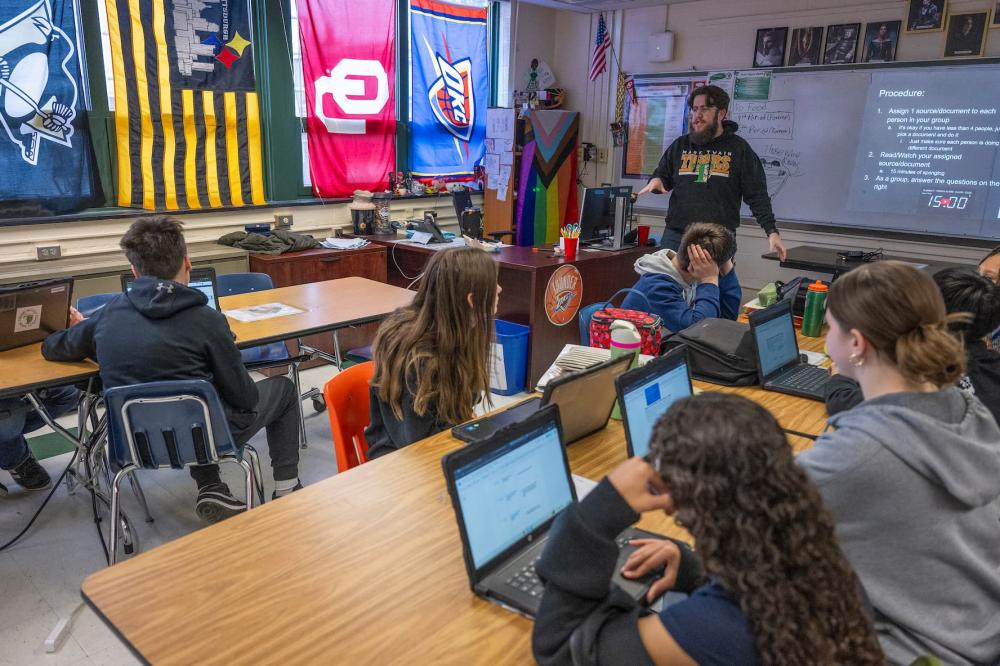 Students attend history class taught by Jacob Marsh at Mark Twain Middle School in Alexandria, Virginia, on March 6, 2025, without smartphones due to the ban. The phone ban at the School is among a wave of measures implemented around the U.S., and is part of a global movement replicated in Brazil, France, and beyond. Supporters believe restrictions will guard pupils from the apparent harms of smartphone use while at school, but opponents say the measures fail to prepare teenagers for the digital world they will inevitably enter.