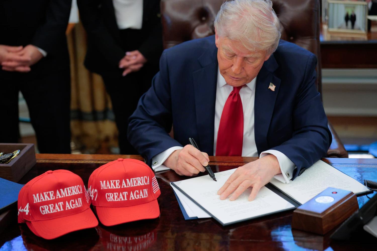 U.S. President Donald Trump signs an executive order in the Oval Office at the White House on April 23, 2025, in Washington, DC. The seven executive orders were related to education policy including enforcing universities to disclose foreign gifts, artificial intelligence education and school disciplinary policies.