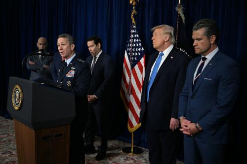 US President Donald Trump (2R) looks on as Chairman of the Joint Chiefs of Staff General Dan Caine (2L) speaks to the press following US military actions in Venezuela, at Trump's Mar-a-Lago residence in Palm Beach, Florida, on January 3, 2026.