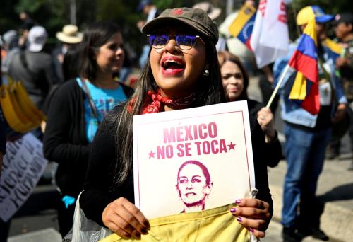 A demonstrator shouts slogans during a march in Mexico City on January 10, 2026, in support of deposed Venezuelan president Nicolas Maduro and his wife Cilia Flores and against a possible US intervention in Mexico.