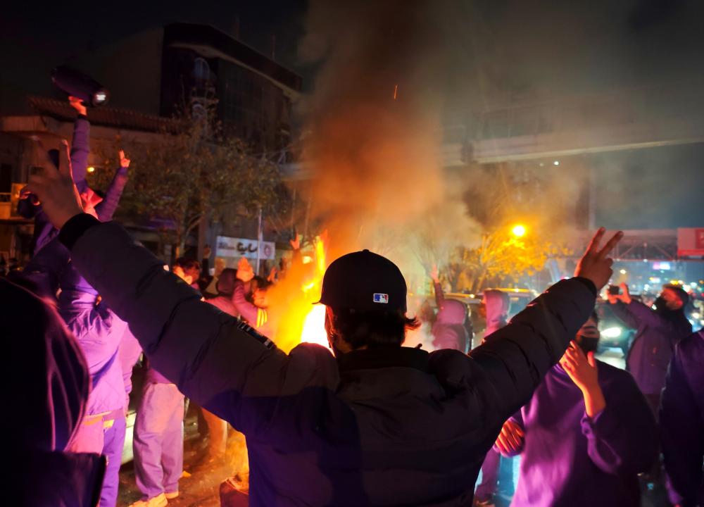 Fires are lit as protesters rally on January 8, 2026 in Tehran, Iran.