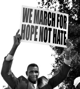 Man holding up protest sign