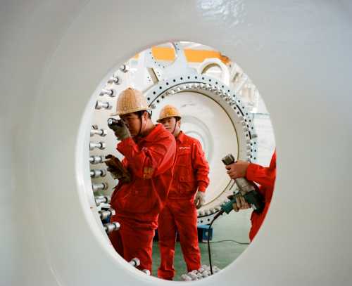 Technicians in wind turbine factory