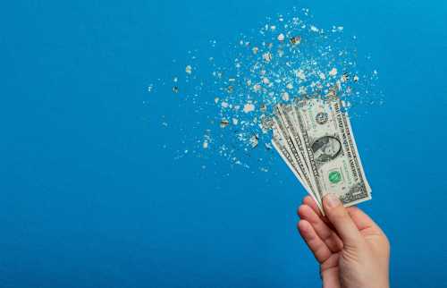 Illustration of dollar bills disintegrating.