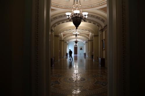 A member of the U.S. Capitol Police stands in a hallway at the U.S. Capitol May 14, 2020, in Washington, D.C. The Senate was scheduled to vote on passage of H.R. 6172, the USA Freedom Reauthorization Act (FISA), that day.
