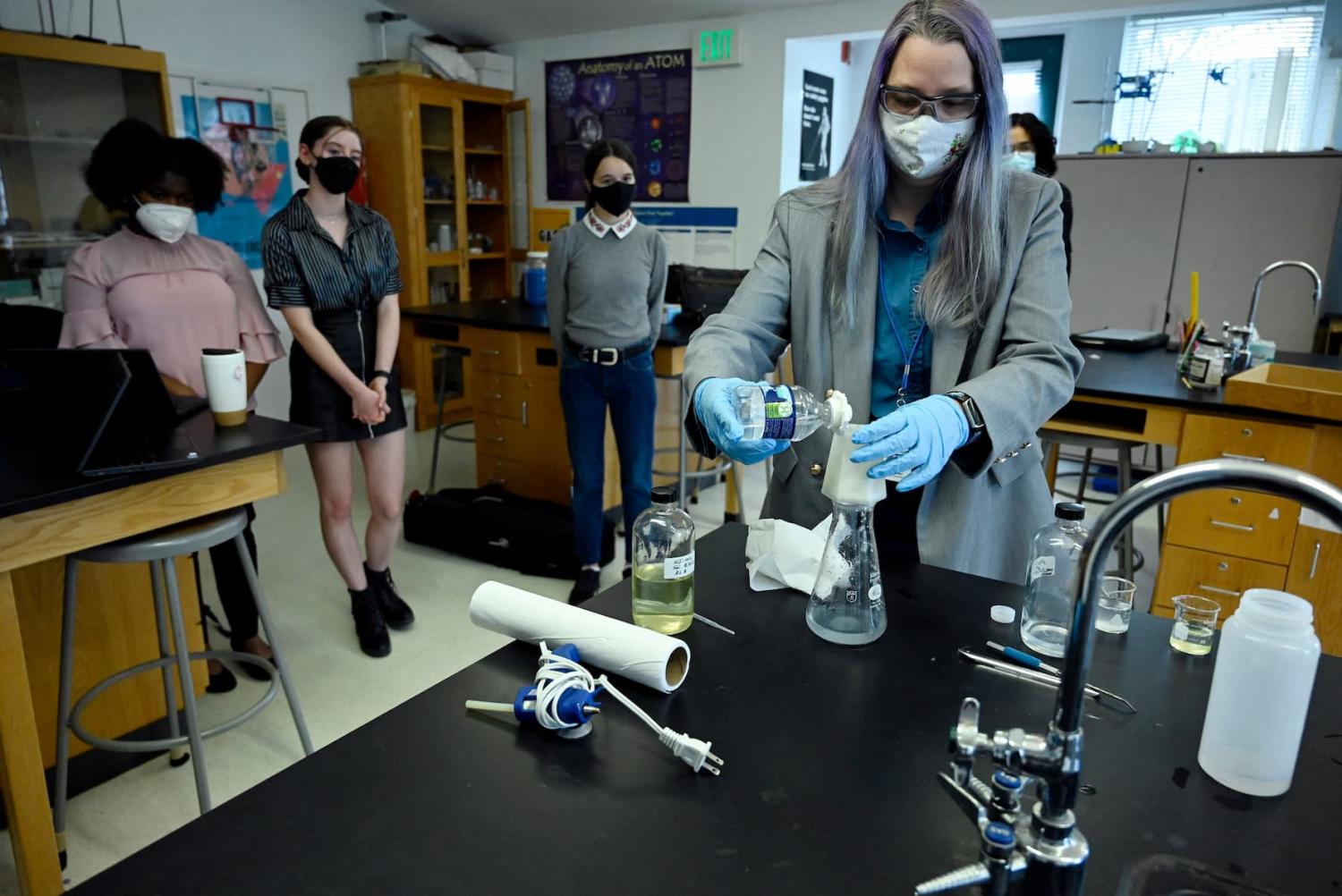 Science teacher Rebecca Bushway demonstrates a low-cost, student-developed water filter at Barrie Middle and Upper School in Silver Spring, Md., on April 21, 2022. During the pandemic, Bushway’s students used 3D printing and chemistry to design the $1 biodegradable prototype to remove lead from faucets.