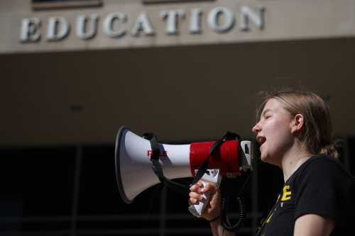 Adah Crandall, 19, of Washington, D.C., participates in the “Rally to Defend Our Schools” in front of the U.S. Department of Education on March 21, 2025 in Washington, D.C.