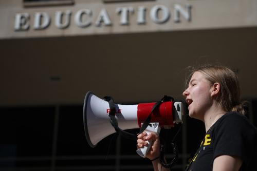 Adah Crandall, 19, of Washington, D.C., participates in the “Rally to Defend Our Schools” in front of the U.S. Department of Education on March 21, 2025 in Washington, D.C.