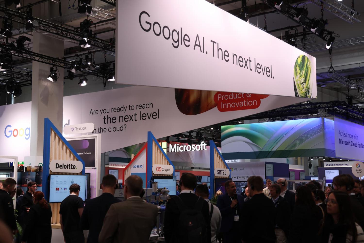 HANOVER, GERMANY - MARCH 31: The Google Cloud and Microsoft pavilions stand next to each other at the 2025 Hannover Messe industrial trade fair on March 31, 2025 in Hanover, Germany. The fair, which showcases German and international industrial production, is taking place as trade relations between the European Union and the United States are becoming fractured by the threat of tariffs by the administration of U.S. President Donald Trump.