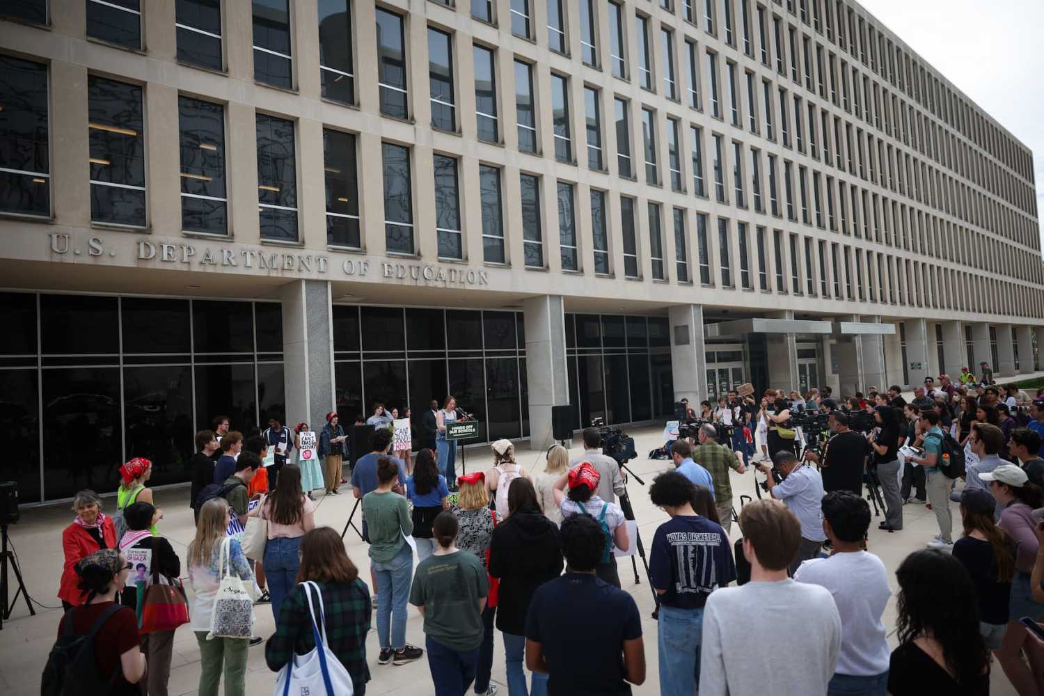 WASHINGTON, DC - APRIL 04: Student protestors hold signs while participating in the "Hands Off Our Schools" rally in front of the U.S. Department of Education on April 04, 2025 in Washington, DC. Students from Georgetown University, Howard University, American University, George Washington University, George Mason University, and Temple University gathered to protest President Donald Trump dismantling of the U.S. Department of Education. (Photo by Kayla Bartkowski/Getty Images)