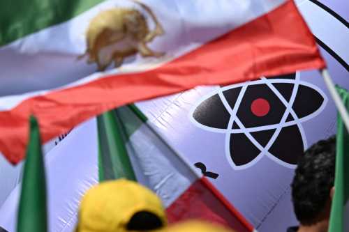 Protestors carry an inflatable effigy of Iran's Supreme Leader Ayatollah Ali Khamenei holding a nuclear bomb during a rally organised by the "National Council of Resistance of Iran" in front of the city hall (Rotes Rathaus) on June 21, 2025 in Berlin.