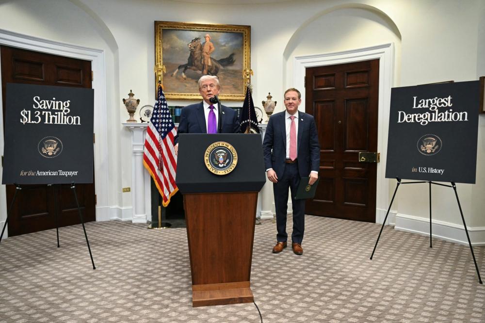 US President Donald Trump joined by US Administrator of the Environmental Protection Agency, EPA, Lee Zeldin, makes an announcement in the Roosevelt Room of the White House in Washington, DC on February 12, 2026.