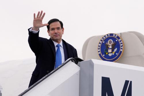 US Secretary of State Marco Rubio waves as he departs Munich International Airport in Munich, southern Germany, on February 15, 2026, after attending the Munich Security Conference (MSC).