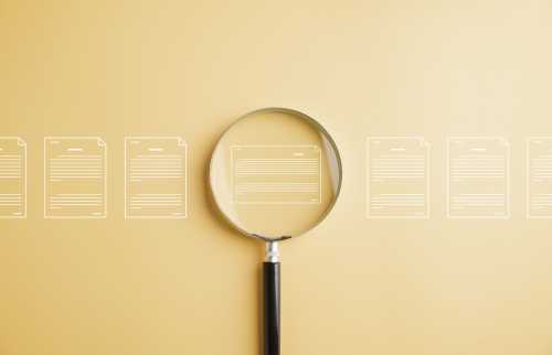 Magnifying glass examining digital files
