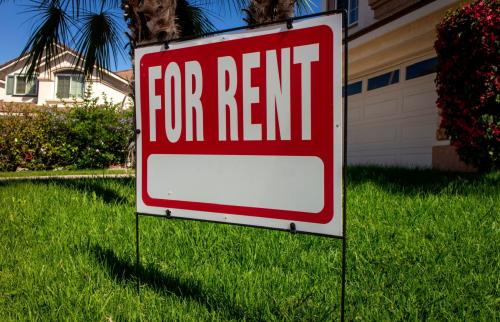 For rent sign in front of a house.