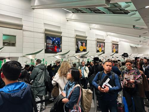 Newark, New Jersey, USA - April 01, 2025: Diverse group of passengers queuing in an airport customs area in Newark, New Jersey.