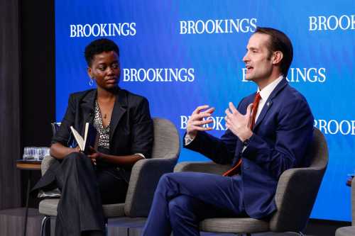 Wall Street Journal reporter Oyin Adedoyin and 15th Under Secretary of Education Nicholas Kent during the event's fireside chat.