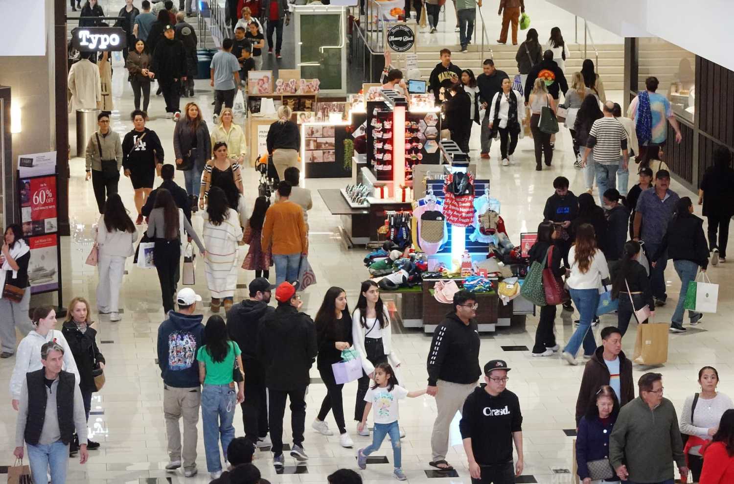 GLENDALE, CALIFORNIA - DECEMBER 26: People shop in the Glendale Galleria shopping mall on the day after Christmas on December 26, 2023 in Glendale, California. U.S. retail sales rose 3.1% year over year this holiday season, based on in-store and online purchases, according to Mastercard SpendingPulse.