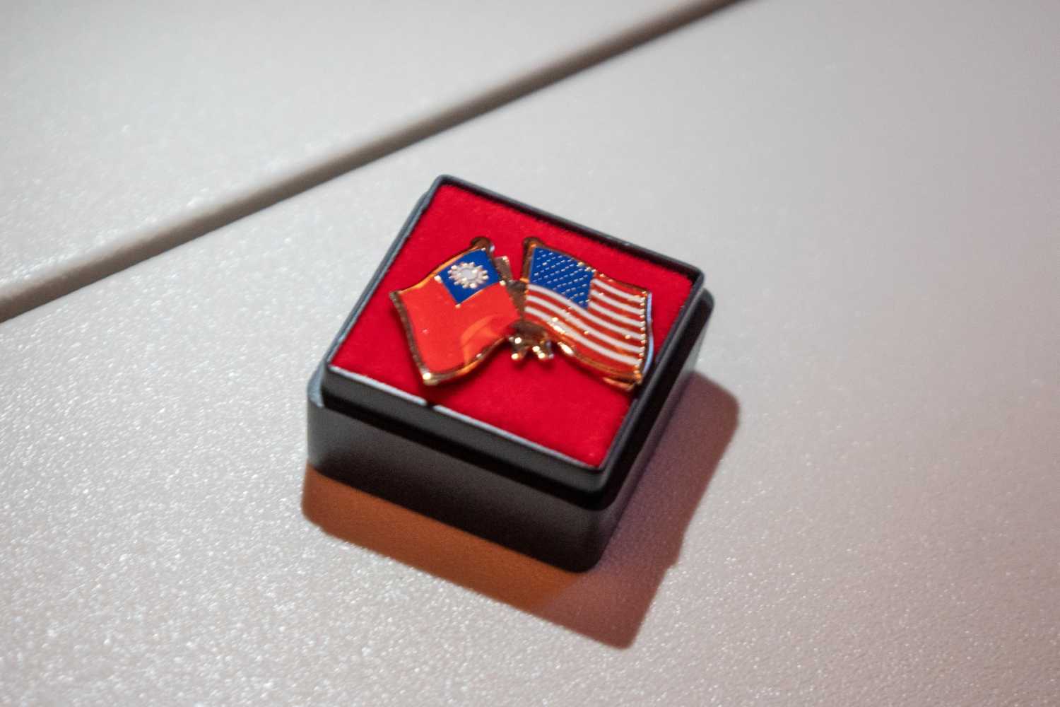 A photo illustration shows a pin depicting the Taiwan and U.S. flags, during Taiwan President Lai Ching-te's visit in Honolulu, Hawaii, on November 30, 2024.
