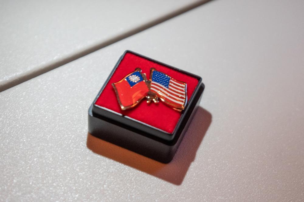 A photo illustration shows a pin depicting the Taiwan and US flags, during Taiwan President Lai Ching-te's visit in Honolulu, Hawaii on November 30, 2024.