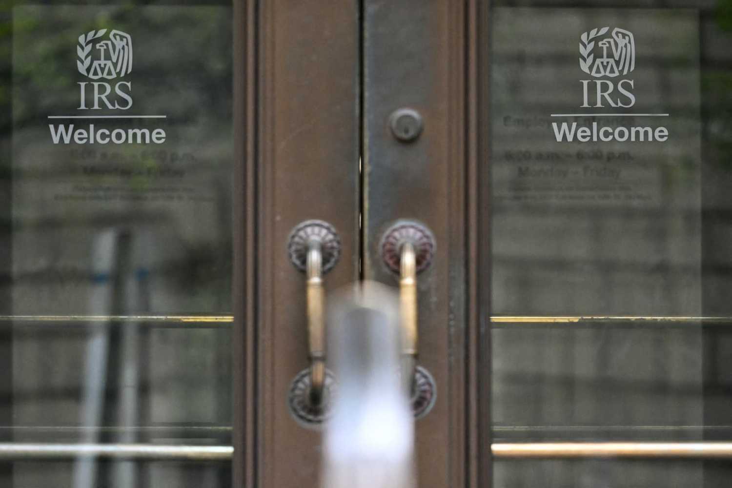 Entrance doors with the IRS logo are seen at the headquarters of the Internal Revenue Service (IRS) in Washington, D.C., on April 15, 2025. The U.S. federal tax agency has reached an agreement to share highly regulated taxpayer information with immigration authorities—a move that could help them identify immigrants they want to deport, court filings showed on April 8, 2025. The deal is a victory for the Trump administration, which has launched a massive deportation push, but has caused an outcry by immigrant rights groups. The Internal Revenue Service (IRS) allows millions of undocumented migrants to pay taxes, a move seen as boosting both their immigration cases and the financial health of massive U.S. federal programs such as Social Security.