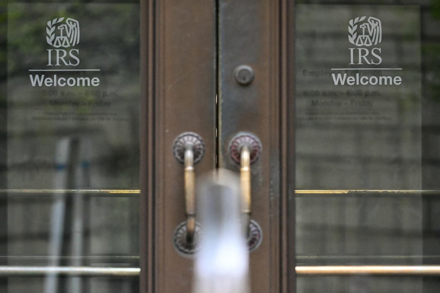 Entrance doors with the IRS logo are seen at the headquarters of the Internal Revenue Service (IRS) in Washington, D.C., on April 15, 2025. The U.S. federal tax agency has reached an agreement to share highly regulated taxpayer information with immigration authorities—a move that could help them identify immigrants they want to deport, court filings showed on April 8, 2025. The deal is a victory for the Trump administration, which has launched a massive deportation push, but has caused an outcry by immigrant rights groups. The Internal Revenue Service (IRS) allows millions of undocumented migrants to pay taxes, a move seen as boosting both their immigration cases and the financial health of massive U.S. federal programs such as Social Security.