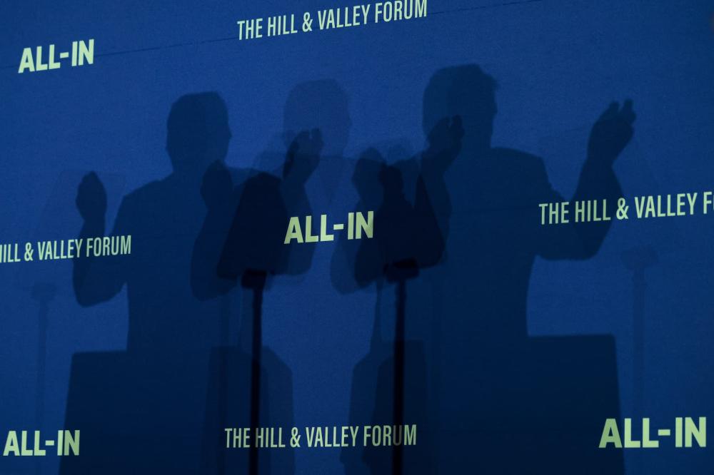 WASHINGTON, DC - JULY 23: A view of the shadow of U.S. President Donald Trump as he speaks during the "Winning the AI Race" summit hosted by All‑In Podcast and Hill & Valley Forum at the Andrew W. Mellon Auditorium on July 23, 2025 in Washington, DC. Trump signed executive orders related to his Artificial Intelligence Action Plan during the event.