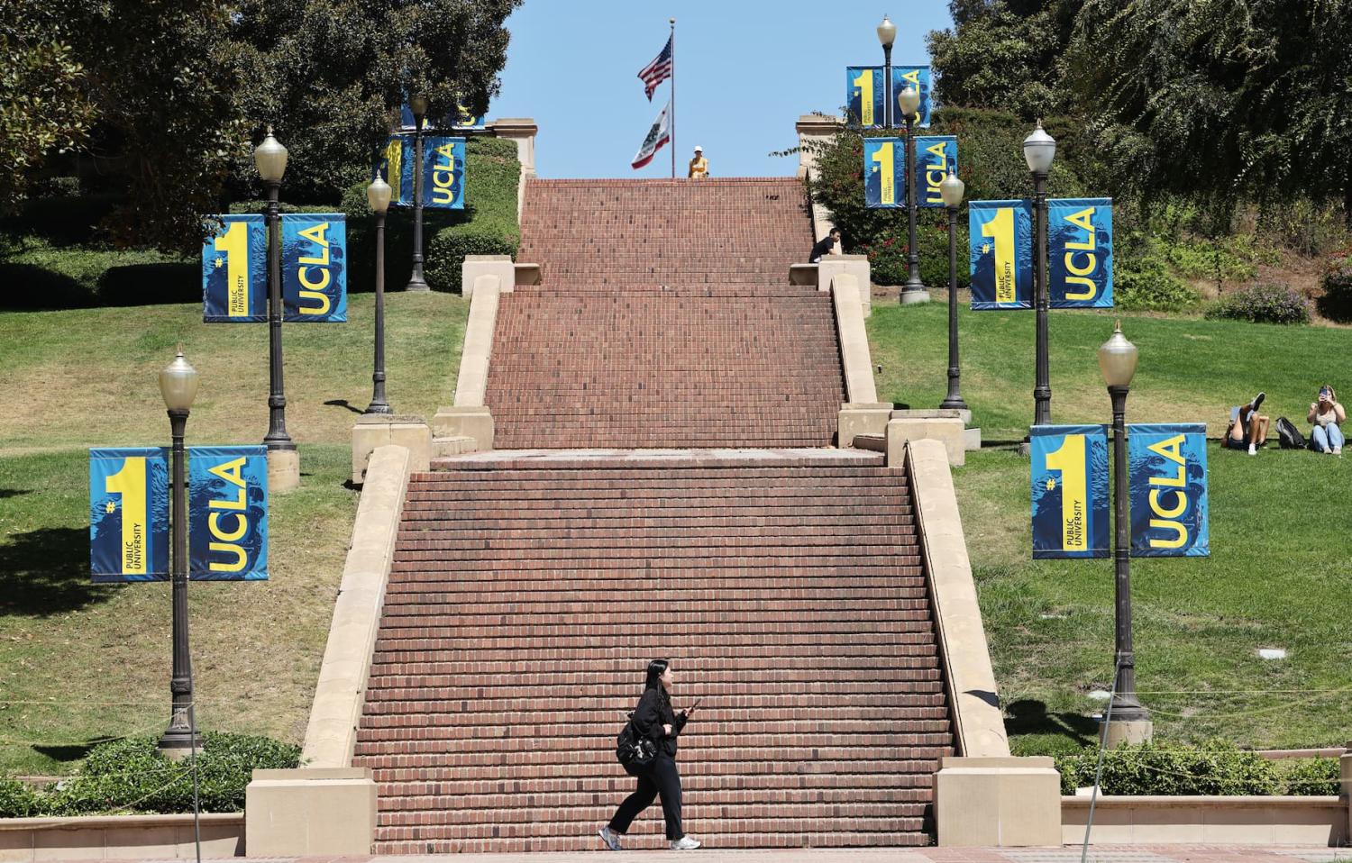 LOS ANGELES, CALIFORNIA - JULY 30: People walk on the UCLA campus on July 30, 2025 in Los Angeles, California.
